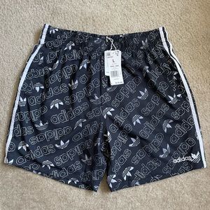 Adidas logo swim shorts. Men size large. **brand new**